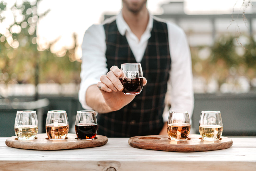 rooftop reds wine flight nyc with male model